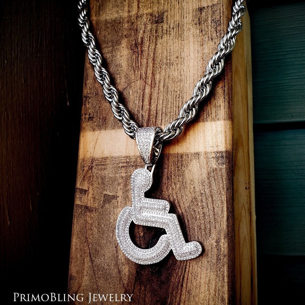Large iced out wheel chair necklace